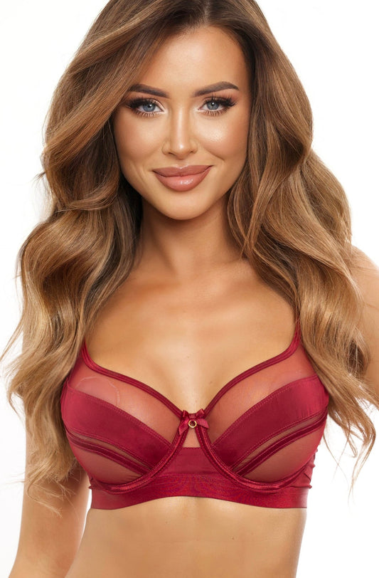 Woman wearing a red lingerie set on a white background