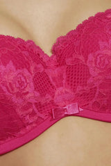 Irresistible hot pink moulded cup strapless multiway bra with two-tone lace, shiny fabric, and a delicate center bow.