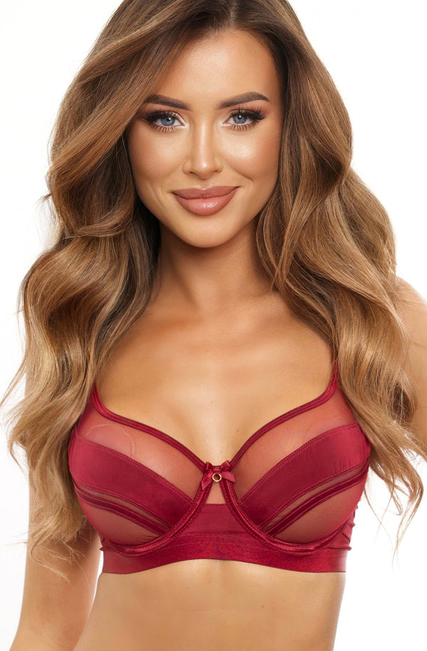Woman wearing a red lingerie set on a white background